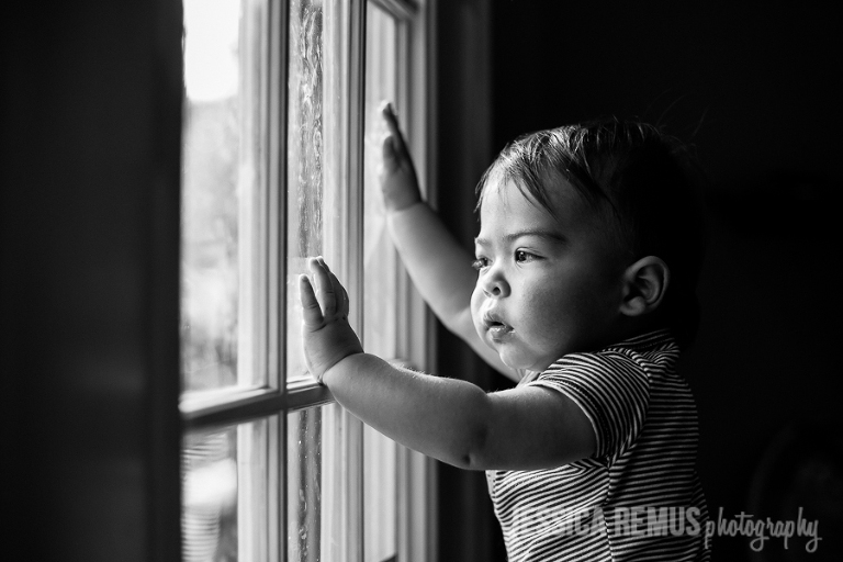 baby boy looking out window