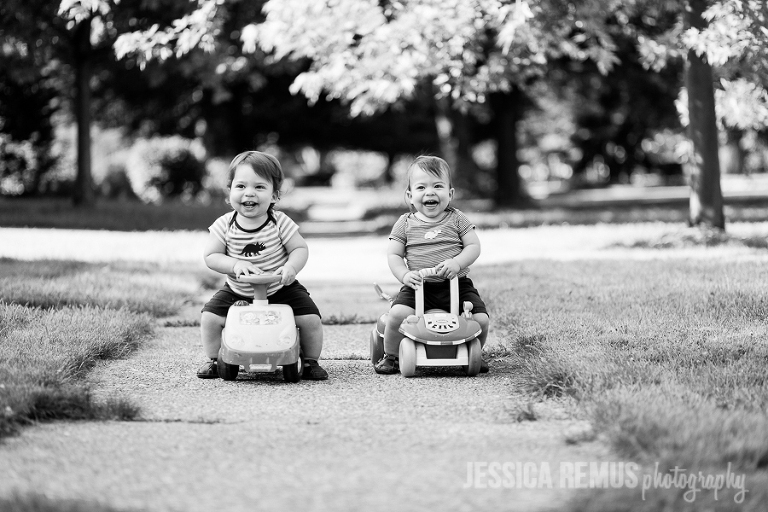baby boy twins on scooters outside front yard