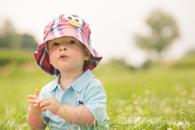 toddler boy in field