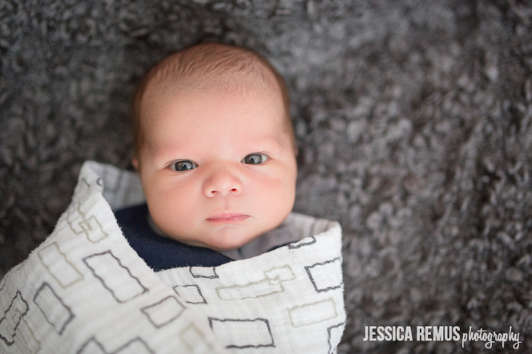 newborn boy on blanket