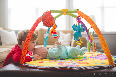 toddler kissing baby sister la grange park home