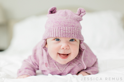 baby smiling on bed la grange il